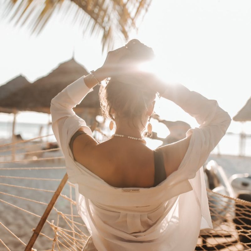 a woman arranging her hair